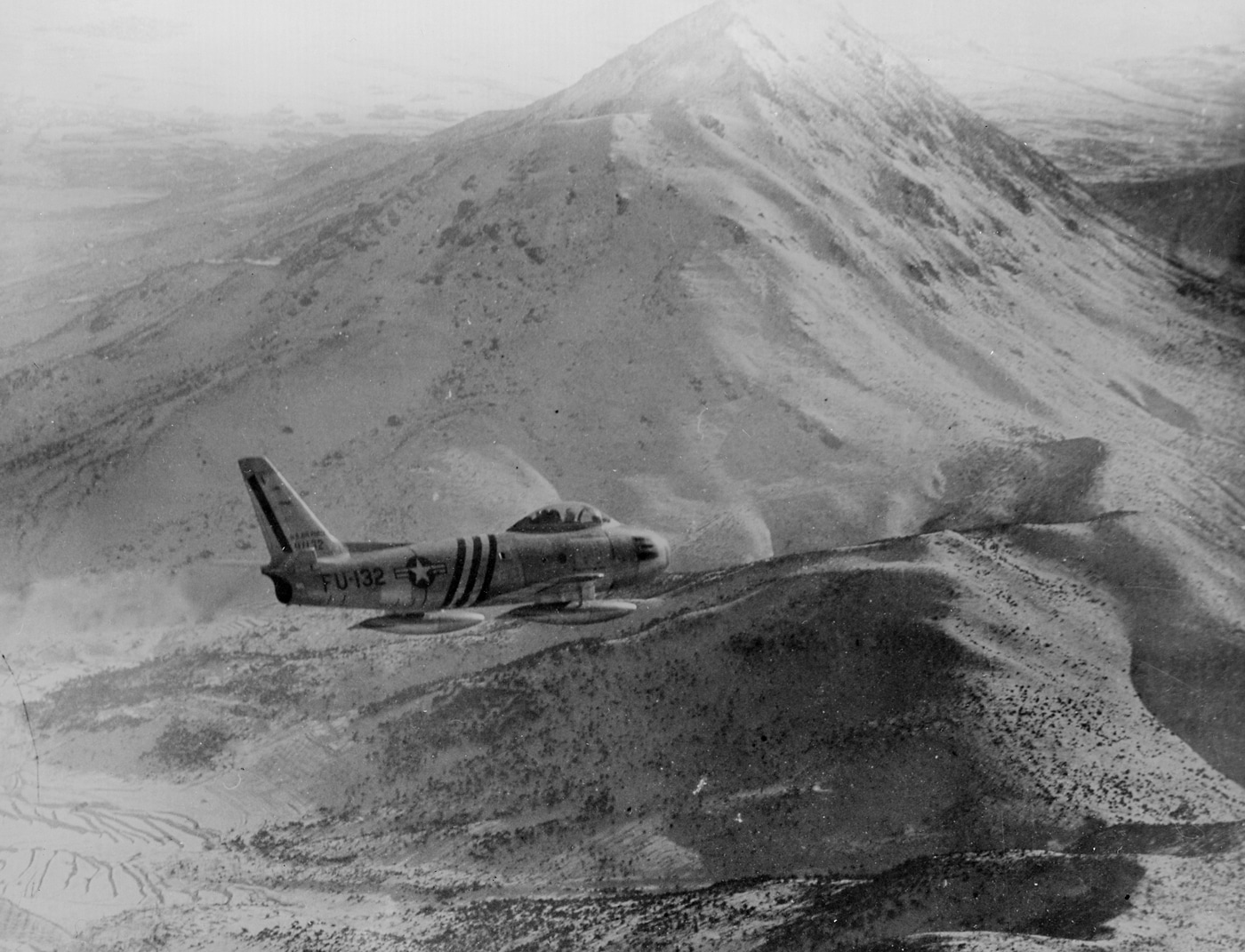 In this image from the Korean War, we see an F-86 flying a patrol over North Korea. The F-86 enjoyed a reputation in this conflict as the North American P-51 Mustang did in World War II. More pilots made fighter ace in the F-86 than any other American jet in Korea.