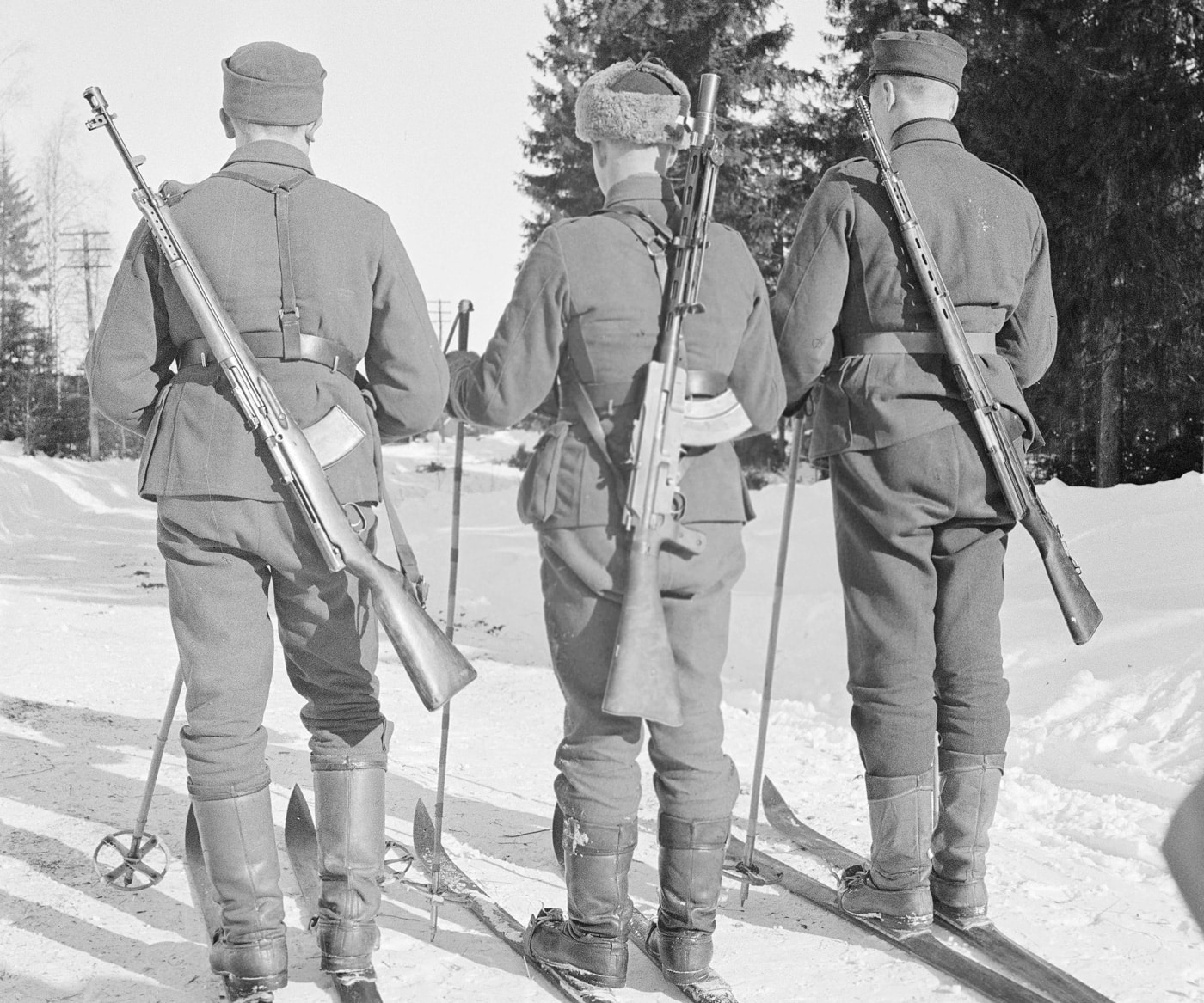 Shown in this image is a Finnish ski patrol with Lahti-Saloranta M26 in the Continuation War against the Soviet Union. 	Aimo Johannes Lahti was a self-taught Finnish weapons designer. Of the 50 weapons he designed, the best known is the Suomi KP/-31 SMG.