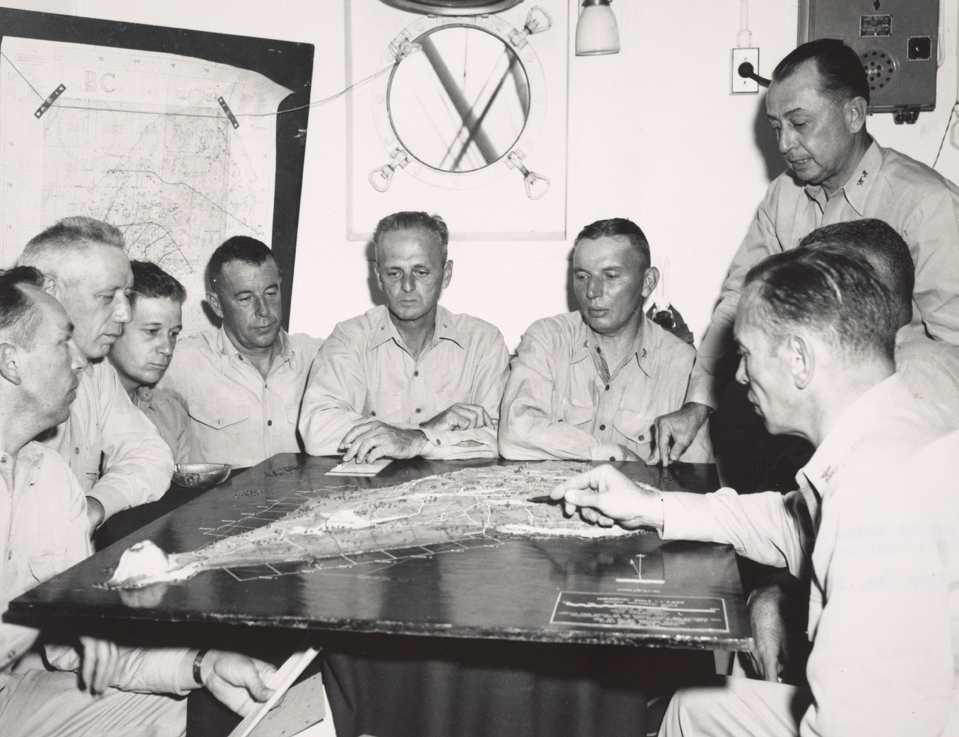 In this photo we see a collection of Marine officers going over the invasion plan of the capture of Iwo Jima ahead of D-Day. Once the battle started, the seizure of Iwo Jima was certain due to good planning and the dedication of the men sent to carry out the invasion plan. Letters from Iwo Jima told tales painted a grim picture of commonplace valor and heroism. 