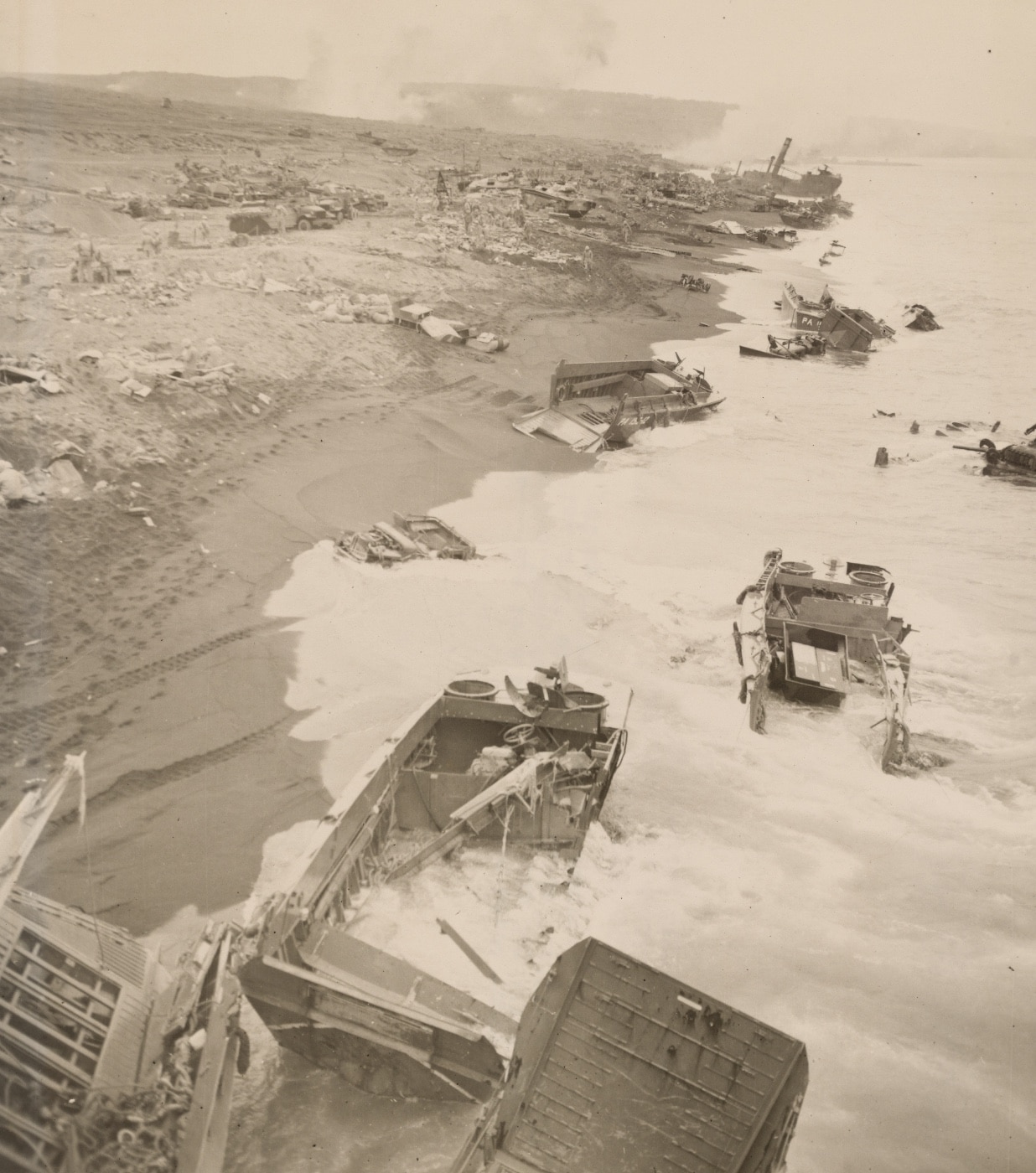 The wreckage of landing craft along the shoreline on the second day of the battle testifies to the stiff opposition put up by the defending Japanese. Image: Cpl. Eugene Jones/U.S. Marine Corps