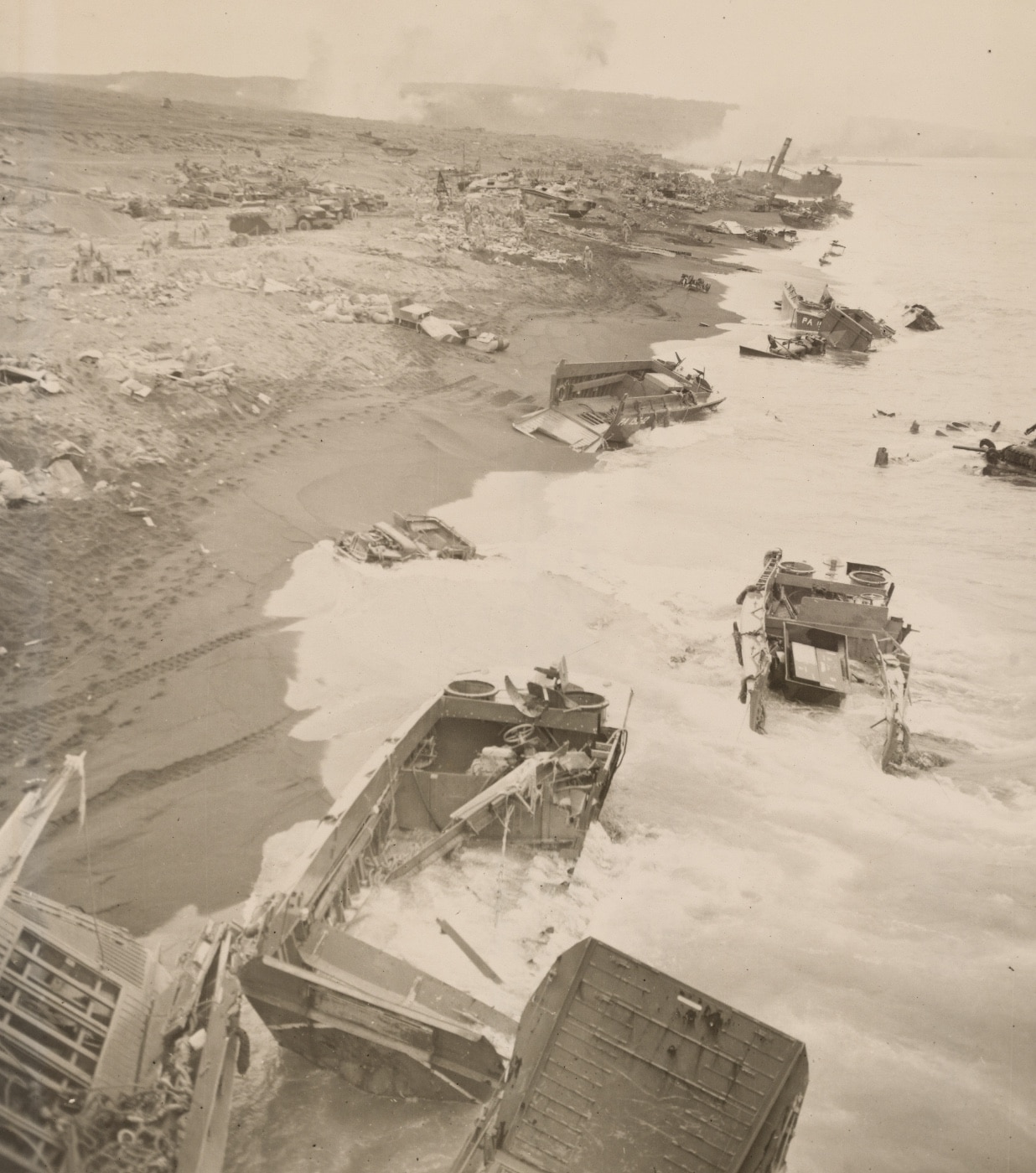 The wreckage of landing craft along the shoreline on the second day of the battle testifies to the stiff opposition put up by the defending Japanese. Image: Cpl. Eugene Jones/U.S. Marine Corps