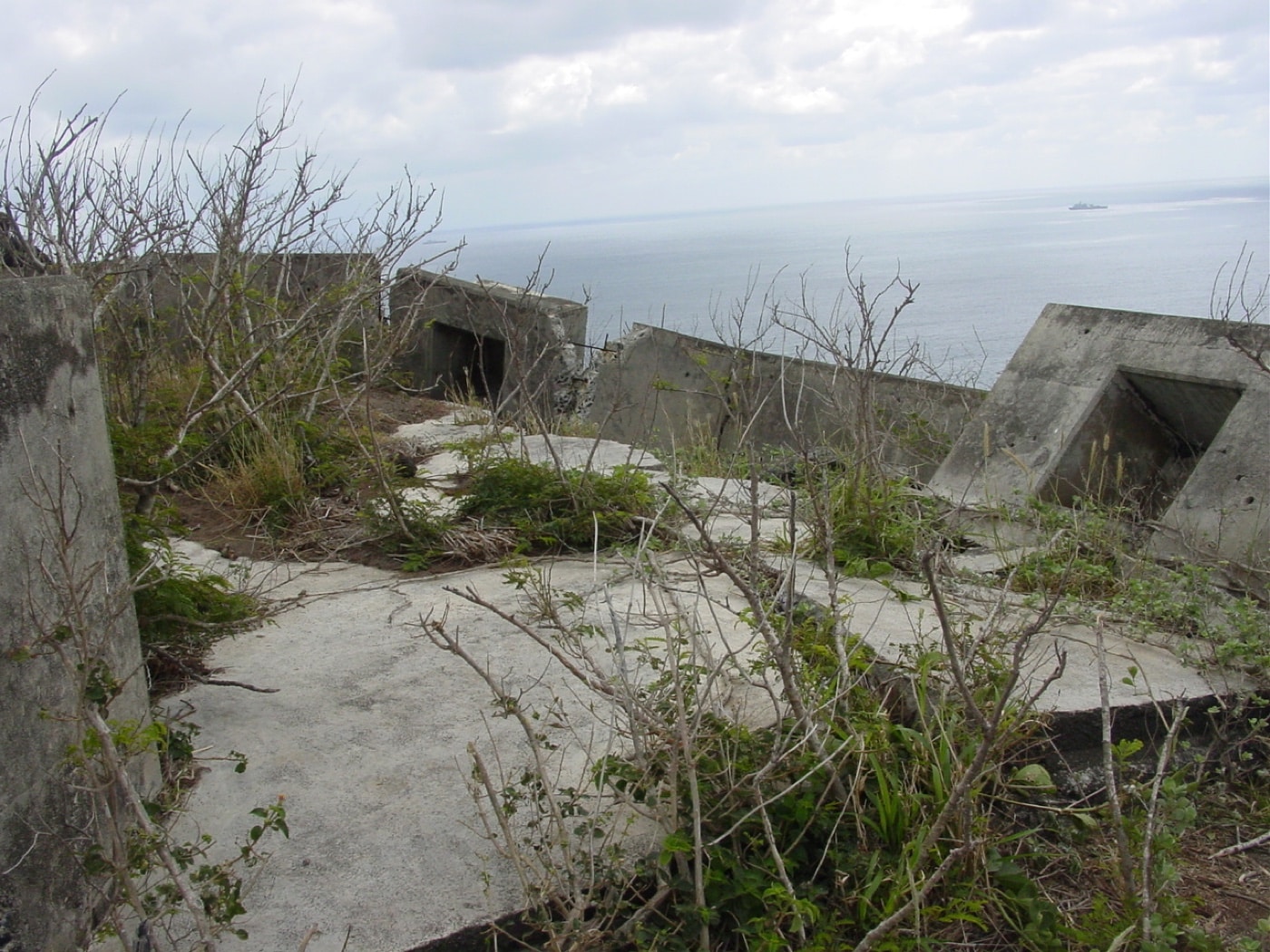 In this photograph we see reinforced concrete bunkers that were part of Iwo Jima even today. During the defense of Iwo Jima, these strongpoints made tough work for the Marines tasked with taking the island. Iwo Jima would claim the lives of thousands of US and Japanese men.
