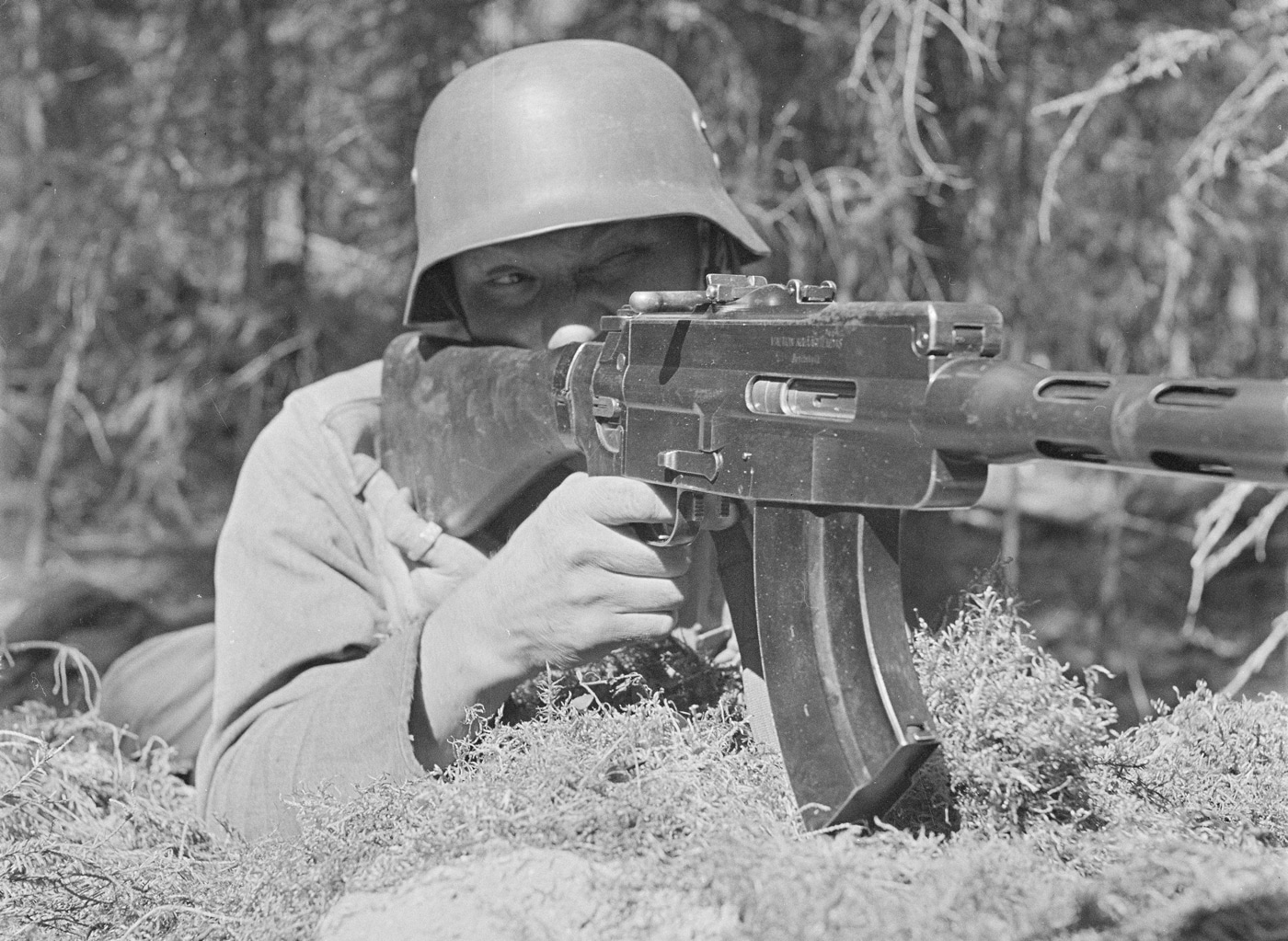 In this digital photograph, we see a Finnish soldier firing the M/26 machine gun. The Finnish Army is the land forces branch of the Finnish Defence Forces. The Finnish Army is divided into six branches: the infantry, field artillery, anti-aircraft artillery, engineers, signals, and materiel troops. Taiwan, officially the Republic of China, is a country in East Asia. It is located at the junction of the East and South China Seas in the northwestern Pacific Ocean, with the People's Republic of China to the northwest, Japan to the northeast, and the Philippines to the south.