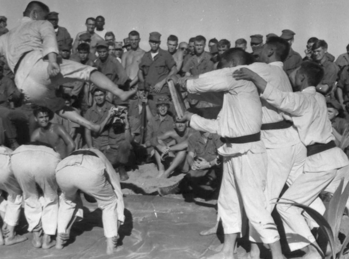 In this image, South Korean Marines demonstrate martial arts during the Vietnam War. Korea is often associated with Taekwondo. However, there are many practitioners of karate, judo, kung fu, Chinese martial arts, kick boxing, Japanese martial arts, mixed martial arts and more. Several of the men in this jpeg are black belts.