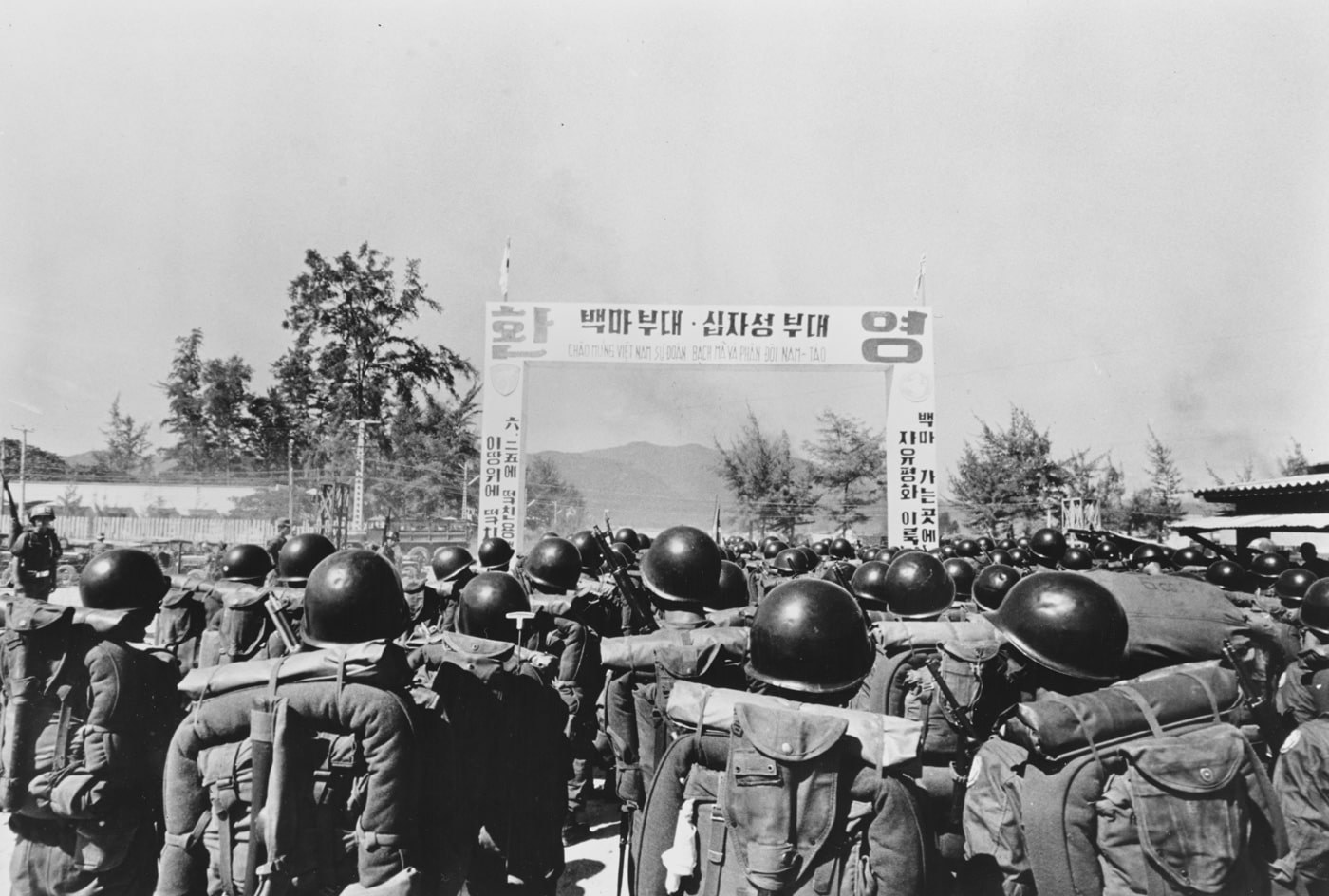 This photo is of the 9th Infantry Division arriving in South Vietnam. The 9th Infantry Division, also known as White Horse Division after the victory of Battle of White Horse Hill, is an infantry division of the Republic of Korea Army. The unit is composed of the 28th, 29th, 30th infantry brigades, and an artillery brigade.