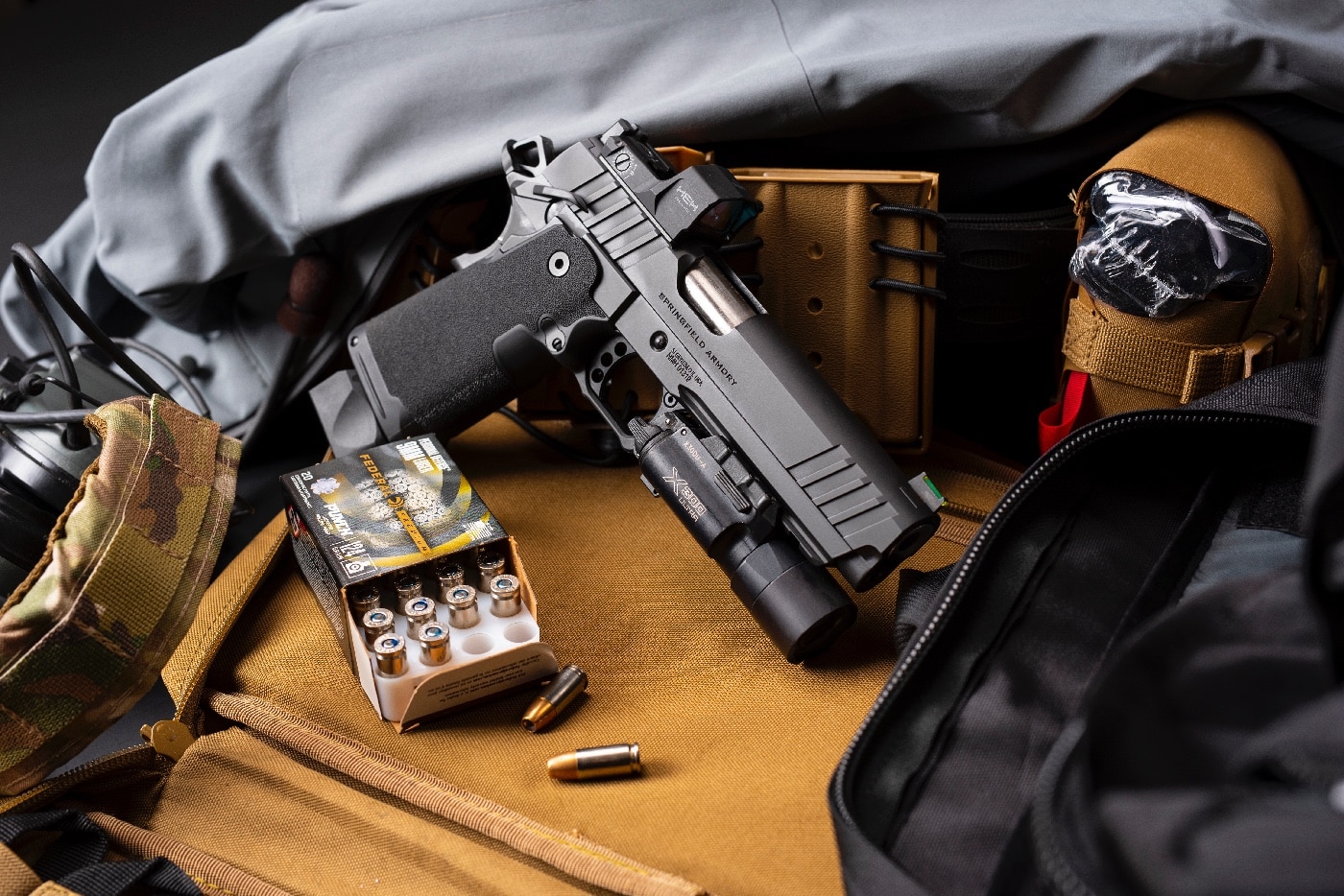 Shown in this digital image, a Springfield Armory Prodigy is shown with Federal Punch 9mm ammo.