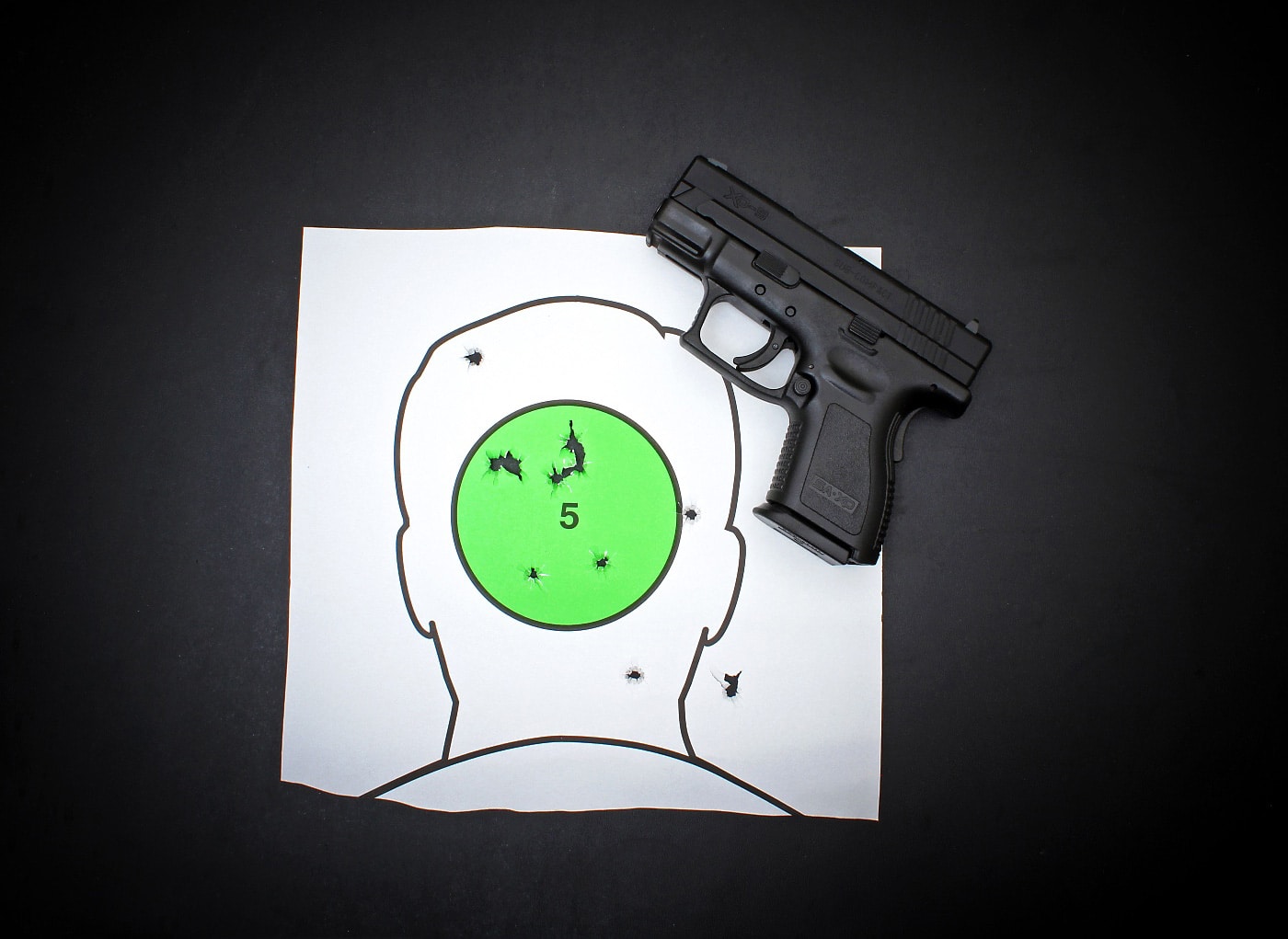 In this photo we see a target with the Springfield XD9 subcompact pistol. 