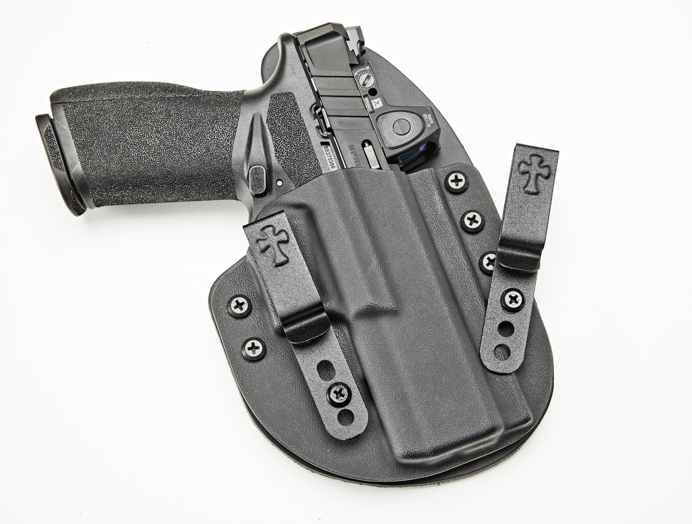 In this photo, we see the Springfield Armory Echelon 9mm semi-automatic pistol in a CrossBreed Reckoning holster. A handgun holster is a device used to hold or restrict the undesired movement of a handgun, most commonly in a location where it can be easily withdrawn for immediate use.