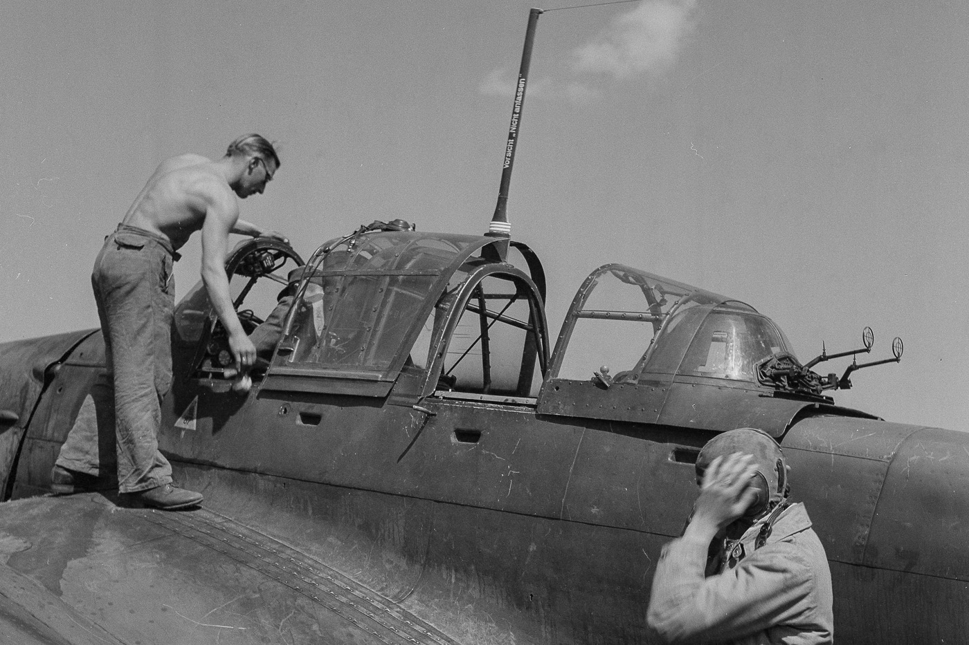 In this photograph, we see a Stuka crew preparing for a mission to destroy the bridges in the Battle of Tali–Ihantala. The Battle of Tali–Ihantala was part of the Finnish-Soviet Continuation War, which occurred during World War II. The battle was fought between Finnish forces — using war materiel provided by Germany — and Soviet forces.