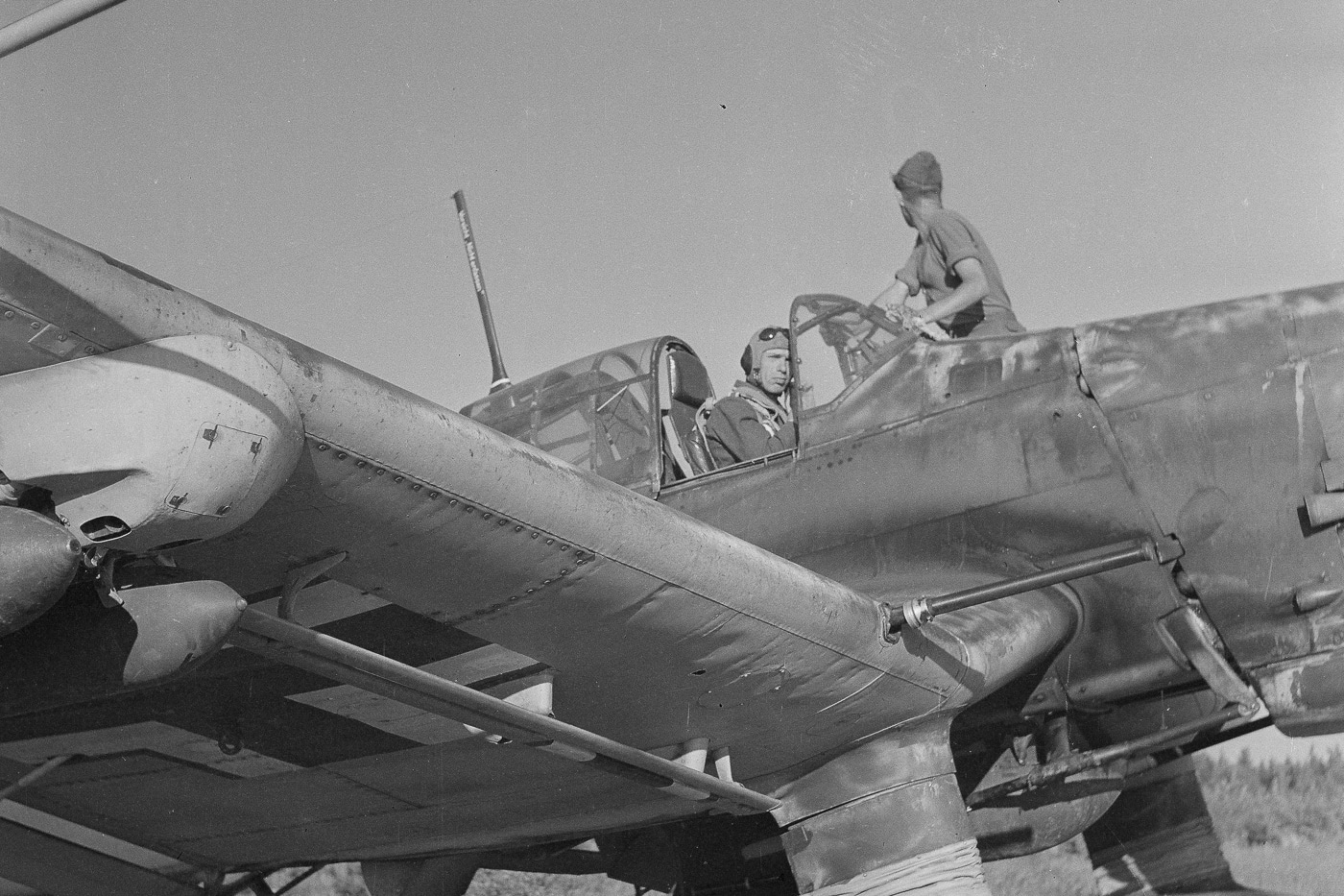 In this black and white photograph, we see a pilot prepare his Junker Ju 87D for take off in the Continuation War. The Continuation War, also known as the Second Soviet-Finnish War, was a conflict fought by Finland and Nazi Germany against the Soviet Union during World War II.