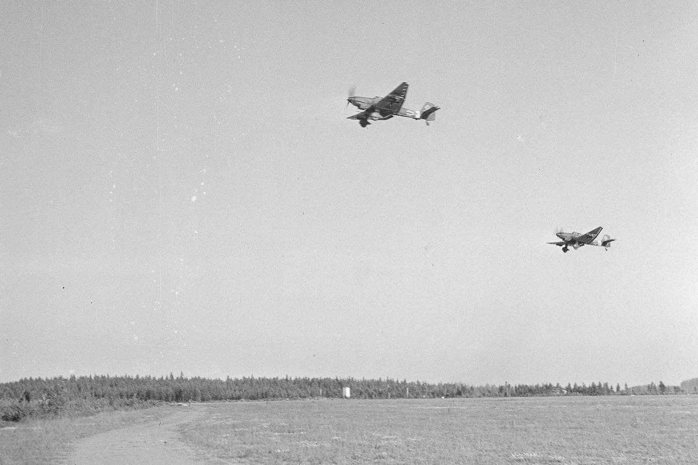 In this photo we see a pair of Stuka dive bombers take off to attack Red Army troops of the Soviet Union. The Workers' and Peasants' Red Army, often shortened to the Red Army, was the army and air force of the Russian Soviet Republic and, from 1922, the Soviet Union.