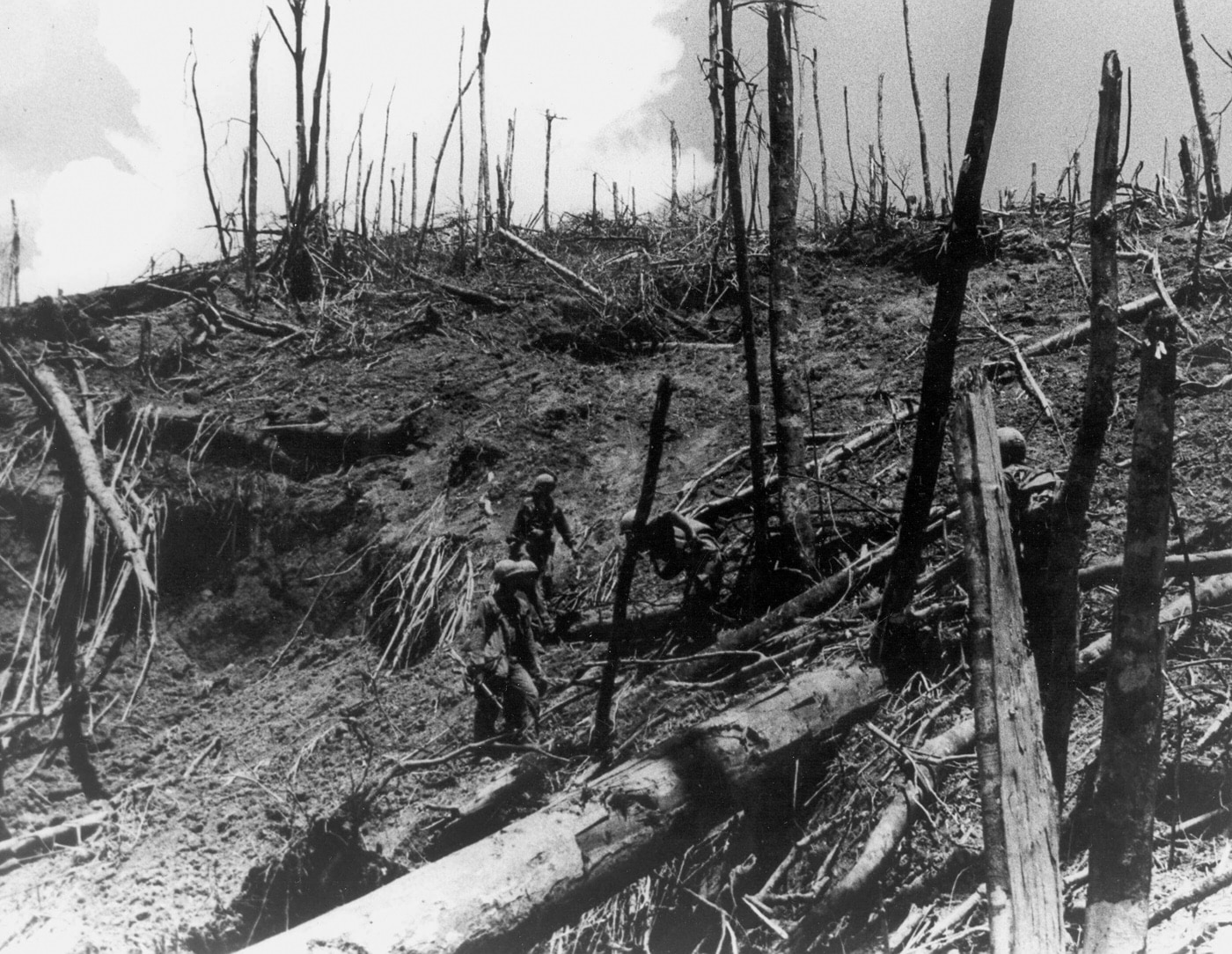 In this photo, we see United States Army soldiers on Hamburger Hill inspecting the damage done to Hamburger Hill during Operation Apache Snow in 1969.