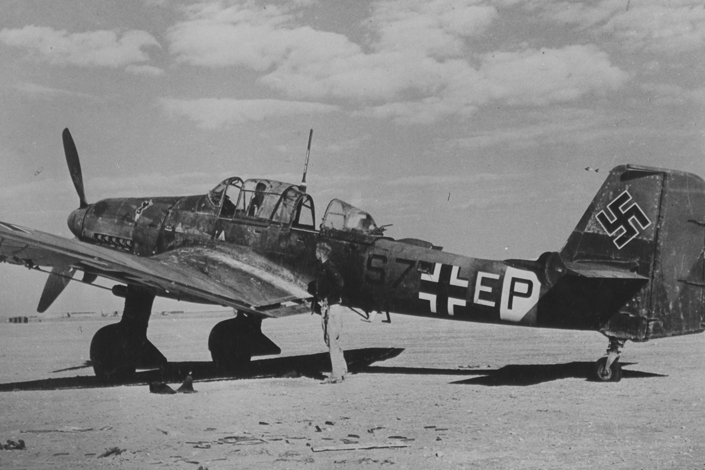 In this photo, we see members of the USAAF inspecting a Stuka abandoned by German troops in Algeria. The United States Air Force is the air service branch of the United States Armed Forces, and is one of the eight uniformed services of the United States. During World War II, it was part of the U.S. Army.