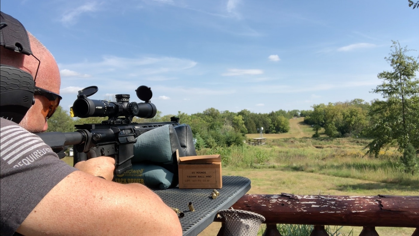 In this photographic image, the author is shooting a Springfield rifle with a mounted GLx 3-18x44mm FFP scope. It can be mounted on a bolt action rifle in addition to a semi-automatic firearm. The Primary Arms ACSS reticle works well at long ranges. The body of the scope is made of 6061 aluminum alloy which will offer good durability while keeping the mass and weight down.