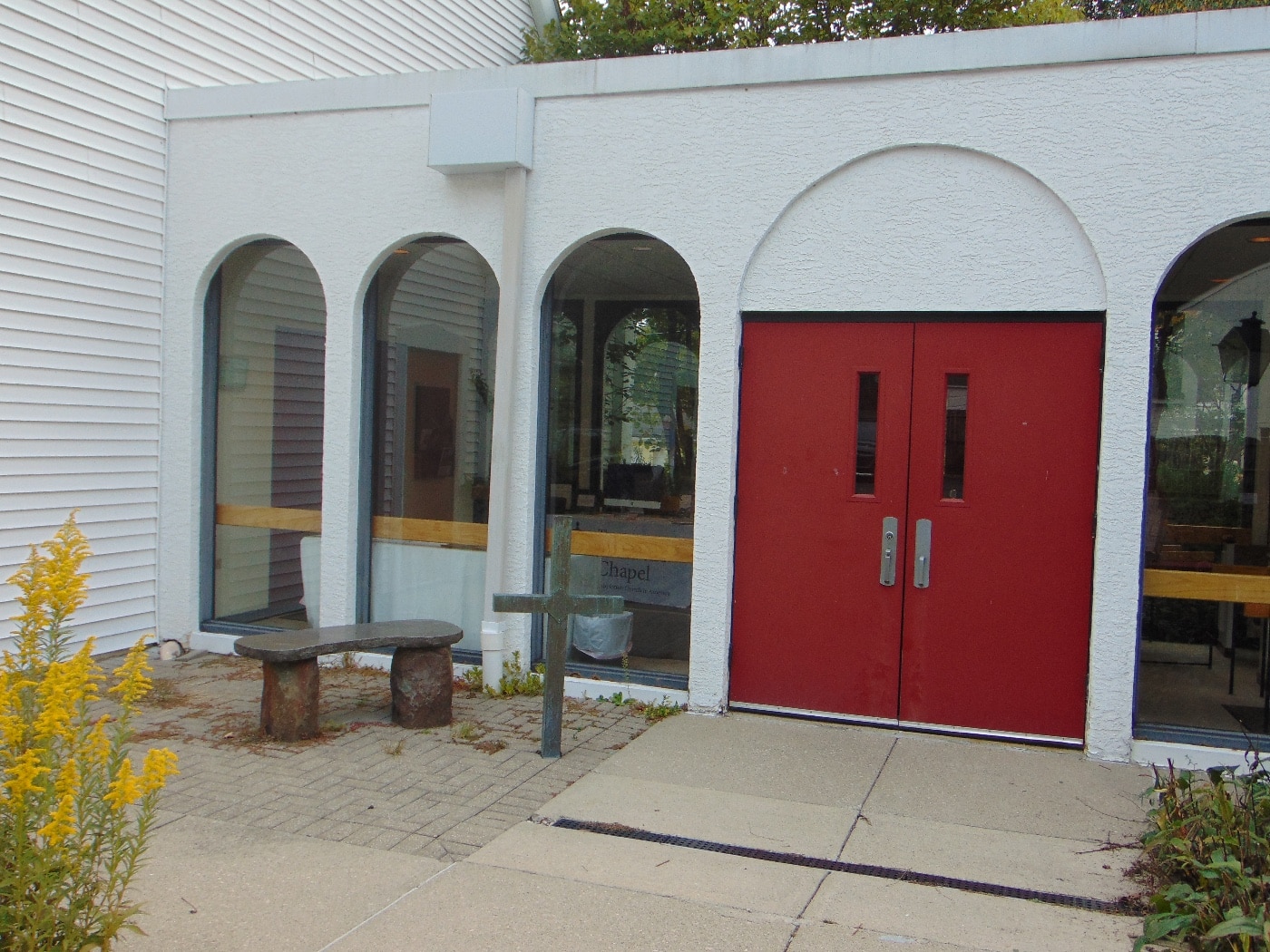 In this jpeg photograph, we see a set of double doors to the church sanctuary. 