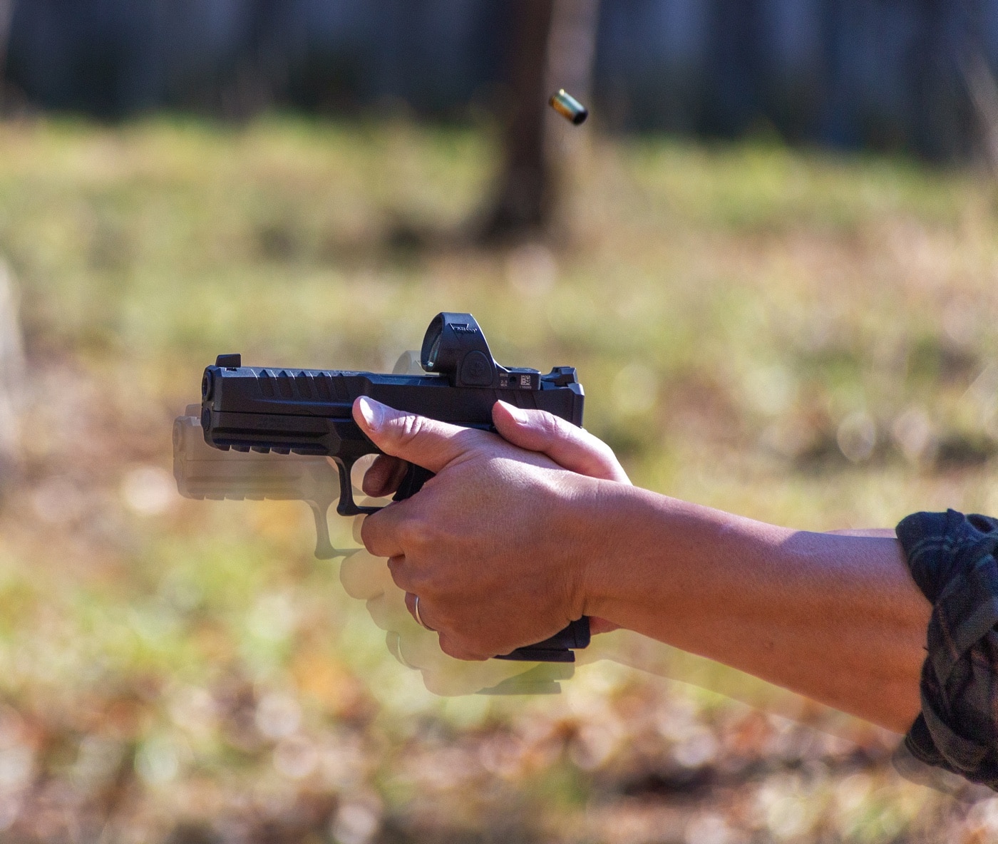 Shown here is a composed image of the author's two-handed shooting with my thumb of the support hand on the pad on the Grip Control.