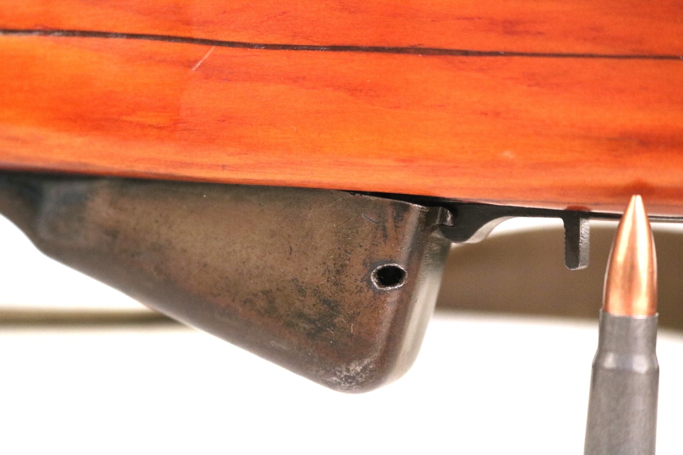 Shown in this photo is the damaged rifle magazine on his SKS. The damage was caused by a grenade fragment. A magazine, often simply called a mag, is an ammunition storage and feeding device for a repeating firearm, either integral within the gun or externally attached.