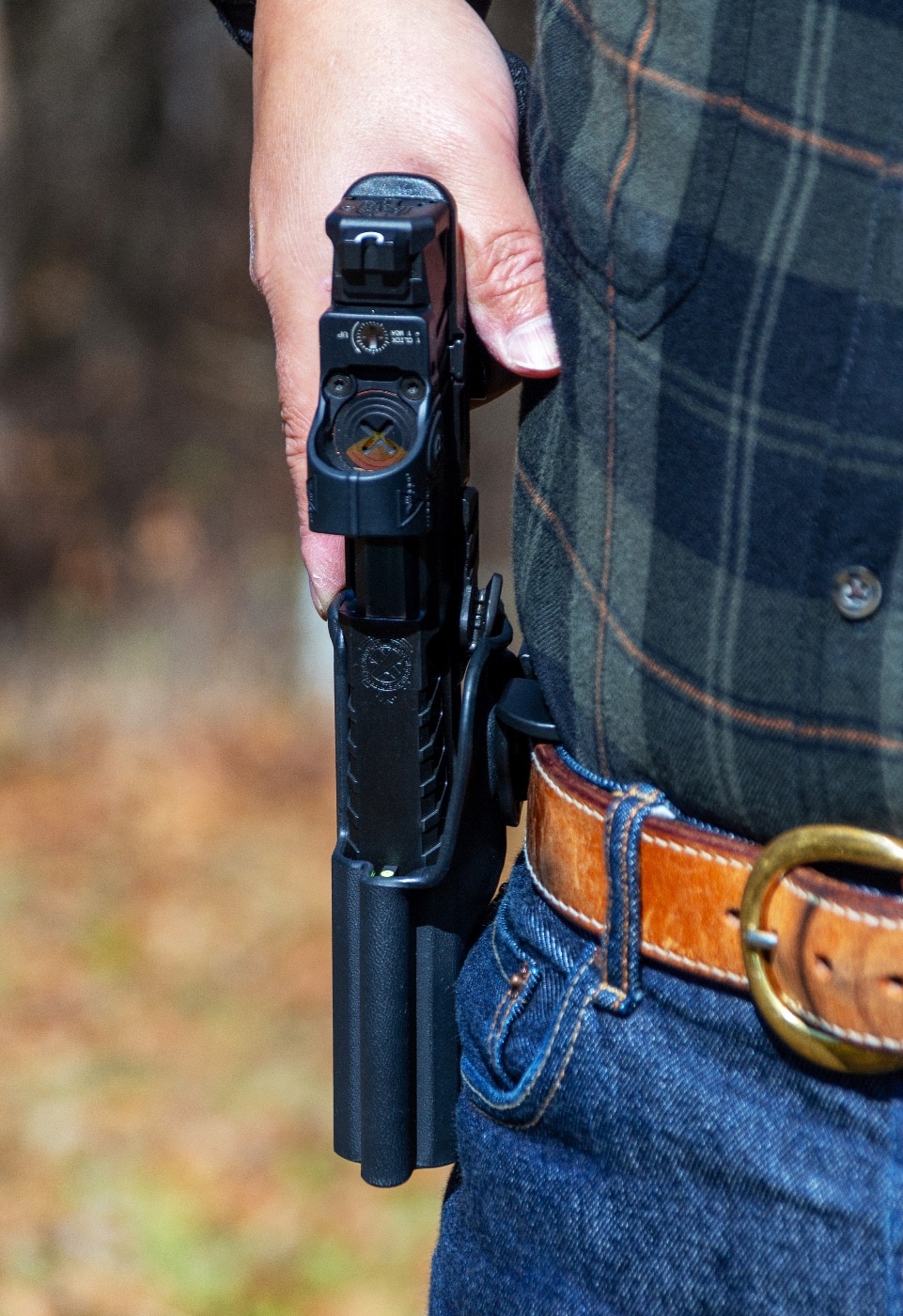 In this photograph, we can see the Grip Control spring open when the Echelon pistol is drawn.