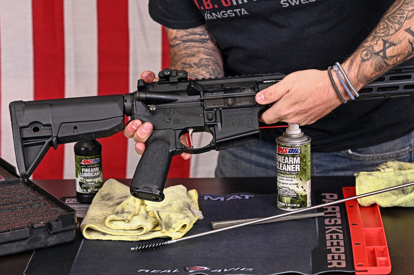 In this photo, we see the author begin the process of cleaning his semi-automatic rifle. A semi-automatic rifle is an autoloading rifle that fires a single cartridge with each pull of the trigger and uses part of the fired cartridge's energy to eject the case and load another cartridge into the chamber.