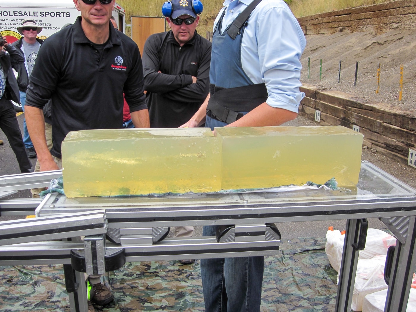 In this photograph, we see several police officers conducting performance and penetration testing of hollow point ammunition in ballistic gel. This test was done in Utah. 