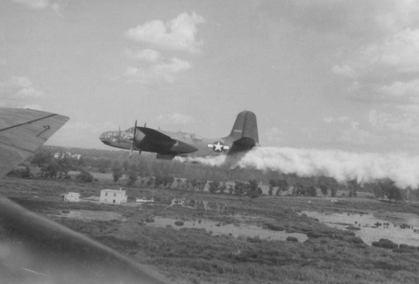 In this image, we see an A-20 used for anti-malarial spraying in Italy. Natousa Anti-Malarial Organization Aircraft Phase. Douglas A-20 Havoc, Taken From Air, Shown Dusitng In Areal Of Lake Patria. Note Extensive Flooding Areas. Larviciding Mission Over Mt. Cuma, Italy.