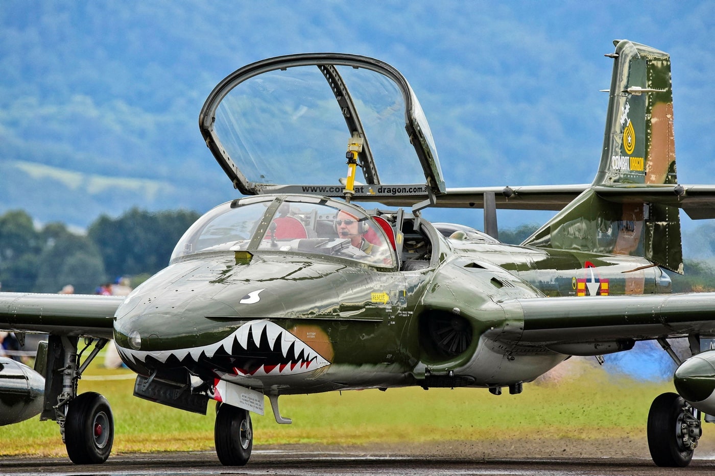 In this image, we see a privately owned Cessna A-37 Dragonfly also known as the Combat Dragon at an air show hosted by the Royal Australian Air Force. An air show is a public event where aircraft are exhibited. They often include aerobatics demonstrations, without they are called "static air shows" with aircraft parked on the ground. The Royal Australian Air Force is the principal aerial warfare force of Australia, a part of the Australian Defence Force along with the Royal Australian Navy and the Australian Army.