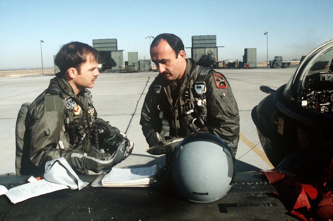 In this photo, we see and aircraft pilot and his co-pilot preparing for a mission in an A-37. An aircraft pilot or aviator is a person who controls the flight of an aircraft by operating its directional flight controls. Some other aircrew members, such as navigators or flight engineers, are also considered aviators because they are involved in operating the aircraft's navigation and engine systems.