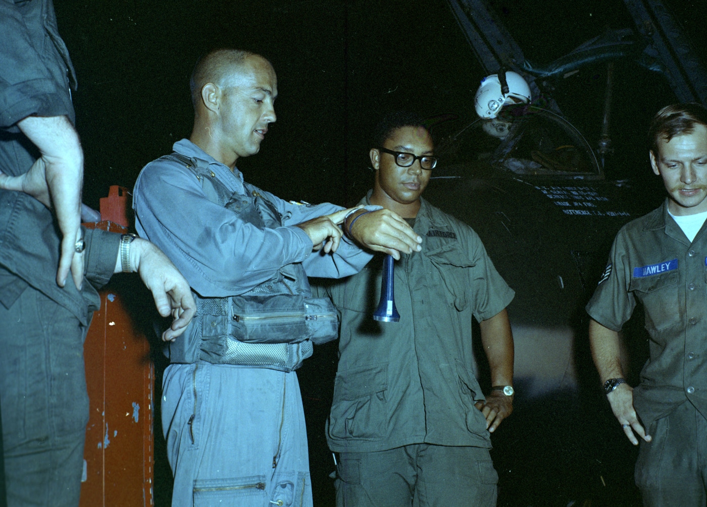 In this photograph, a B-57 pilot provides a mission briefing to his crew.