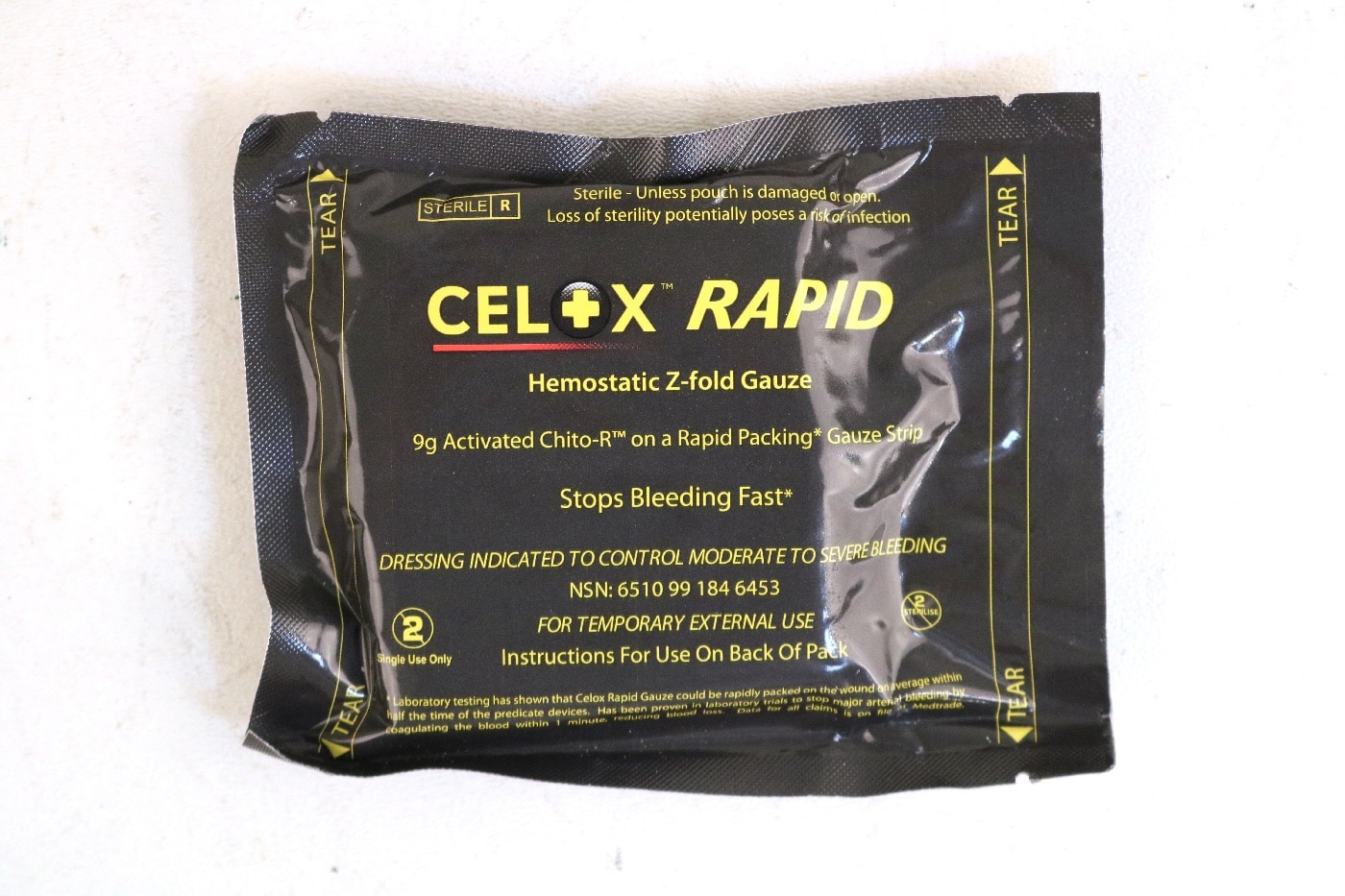 In this photograph, we see a Celox hemostatic bandage. This is good for packing a wound.