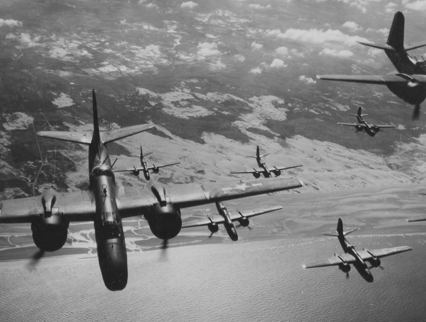 This image shows a formation of Douglas A-20G Havoc bombers going "feet wet" over the English Channel after a bombing mission in Normandy, France. The U.S. Army Air Force had a wide range of light, medium and heavy bombers at its disposal to hit Nazi Germany with.