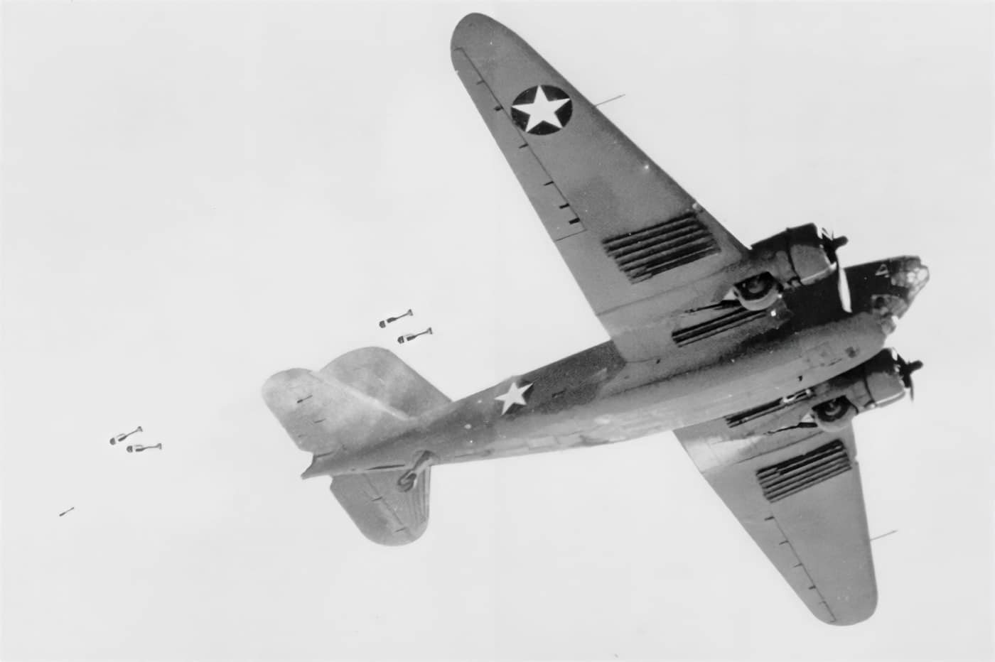 In this digital image, we see a Douglas B-18 launching depth charges at a German U-boat. A depth charge is an anti-submarine warfare weapon designed to destroy submarines by detonating in the water around the target and subjecting it to a destructive hydraulic shock.