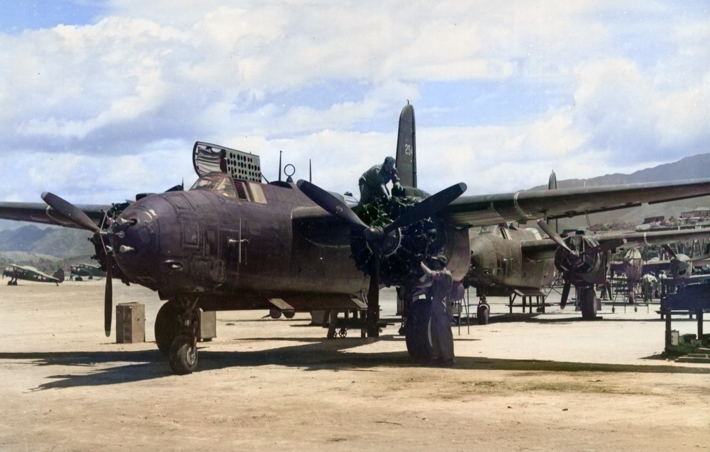 In this photo, men of the 2nd Aircraft Assembly Squadron, 13th Air Depot Group work to assemble Douglas P-70 airplanes at Megenta Air Base in New Caledonia on November 13, 1943. New Caledonia is a French territory comprising dozens of islands in the South Pacific. 