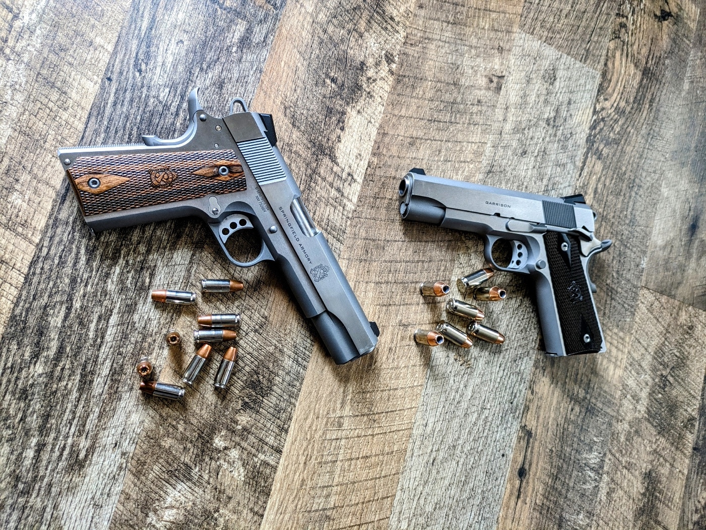 In this photograph, we see both of the Springfield Armory Garrison 1911 pistols — one in 9x19mm Parabellum and the other in .45 ACP.