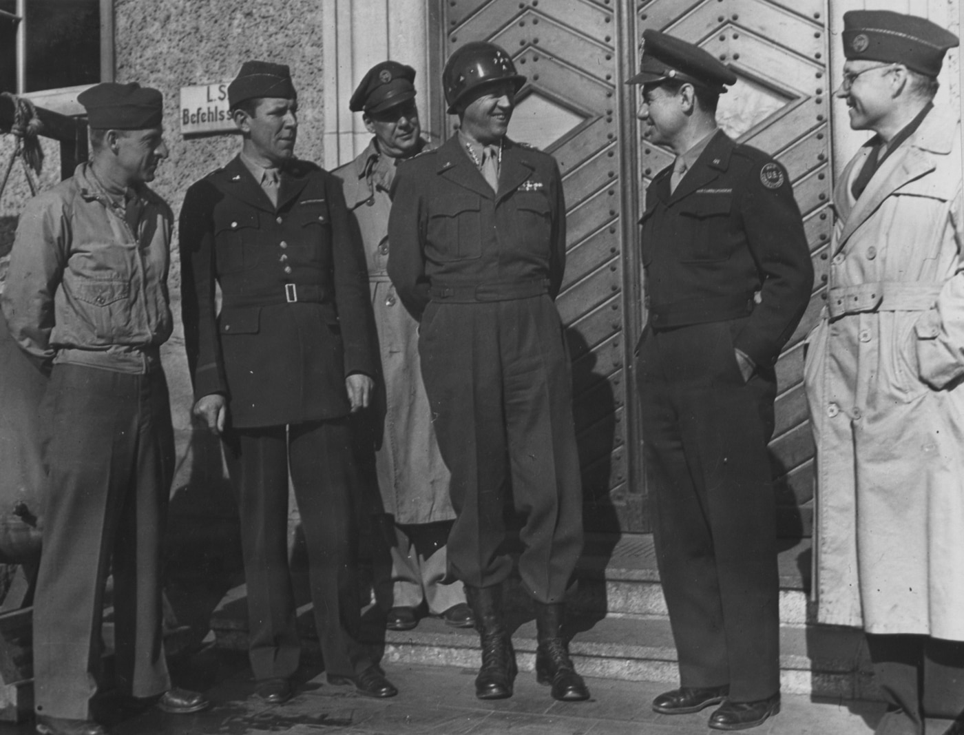 In this photo, Gen Patton talks with radio operators and correspondents from the U.S. media.