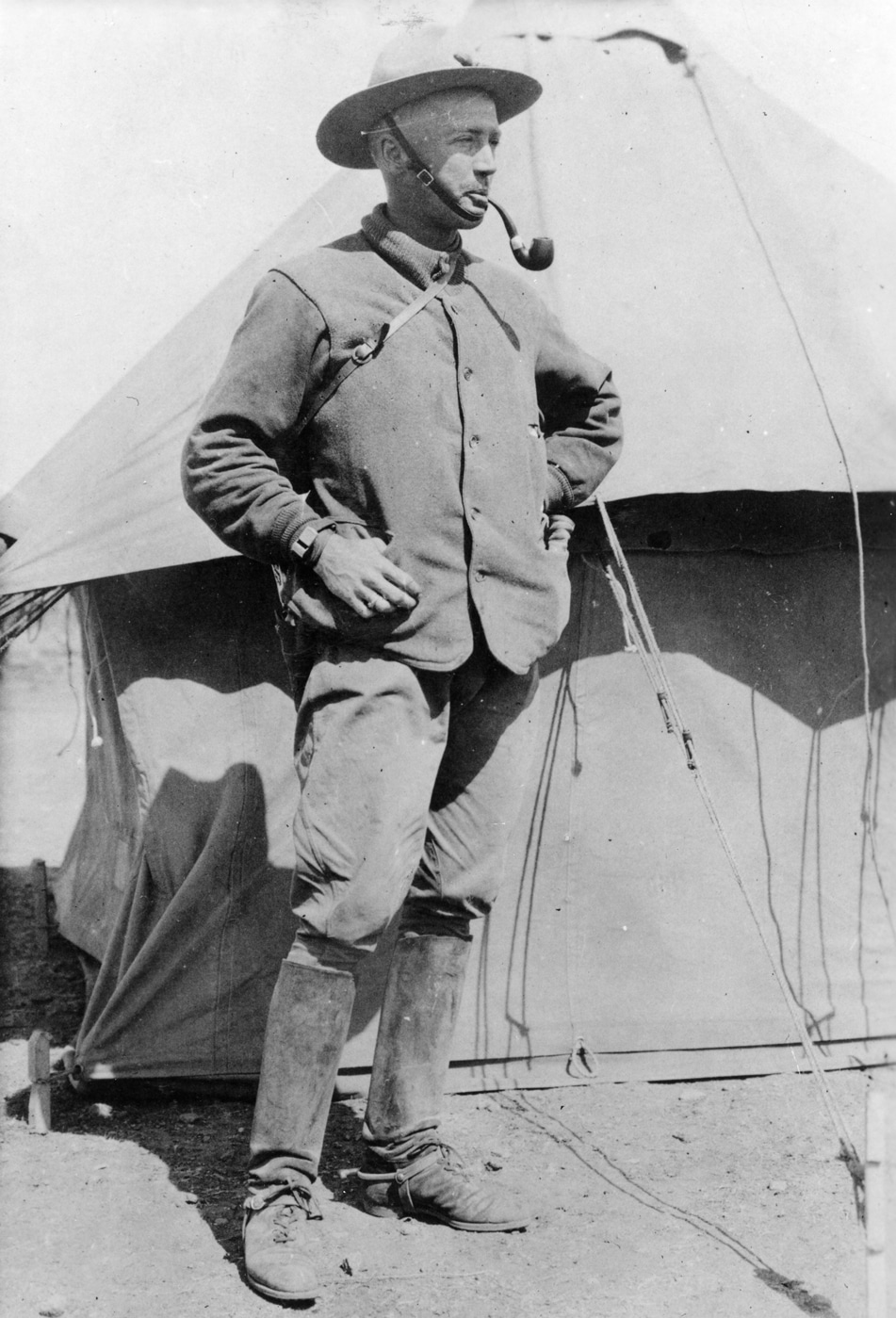 In this photograph from the Texas Mexico border, George Patton smokes a pipe. He was aide to Gen Pershing.