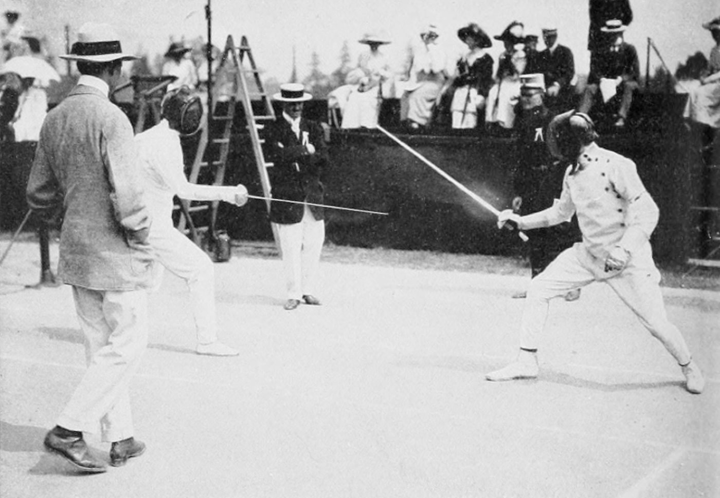 In this photograph we see George Patton in a fencing match at the 1912 Olympics.