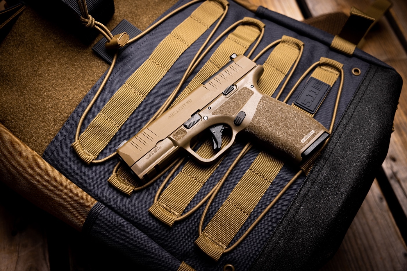 In the photo we see the Hellcat Pro with the Desert FDE finish. It has all of the standard features common to the line including the Adaptive Grip Texture and u-dot sights.
