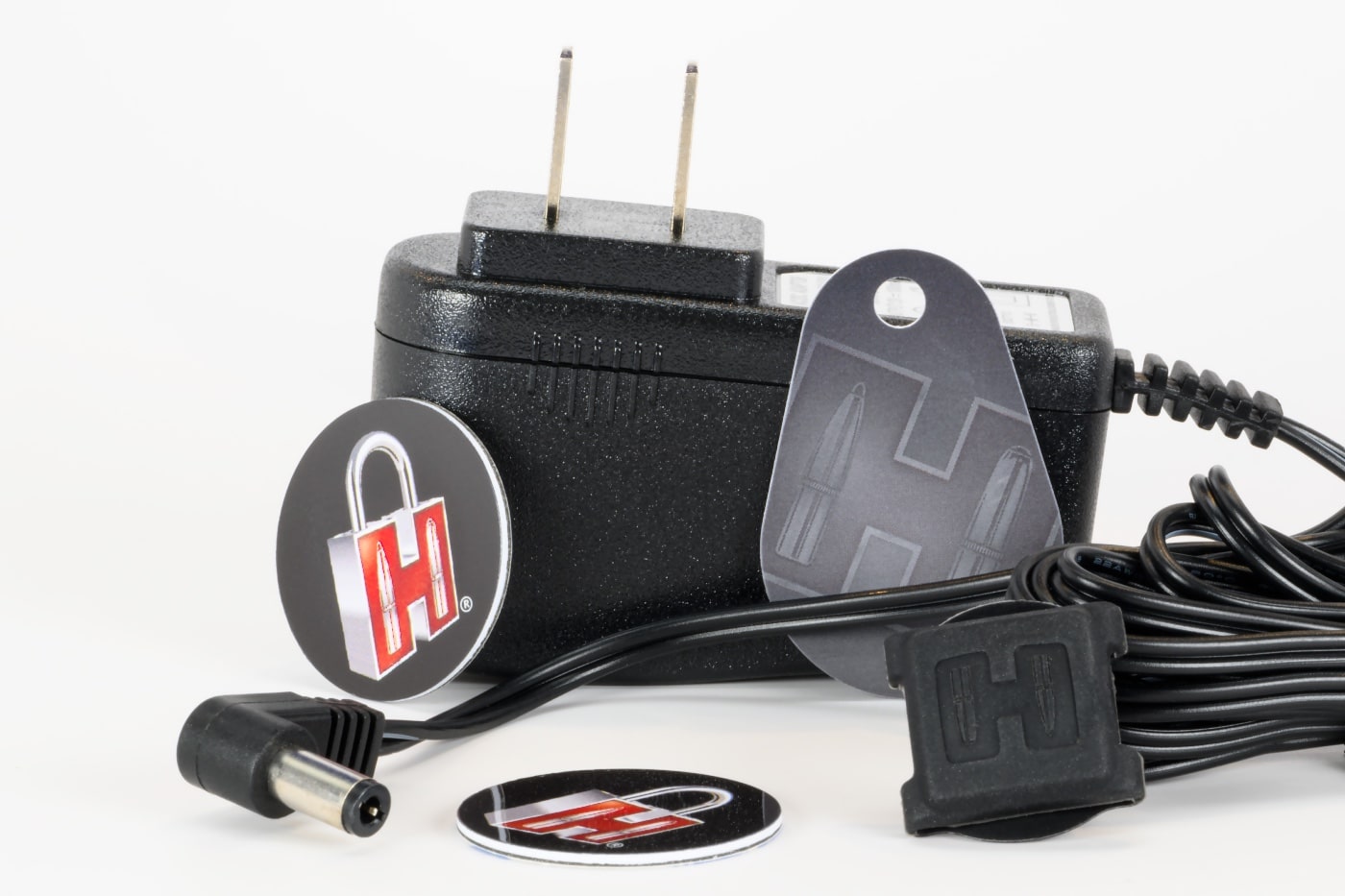 Shown here are a 12v power adaptor, RFID key tags and other accessories for the Hornady RAPiD Safe Ready Vault. 