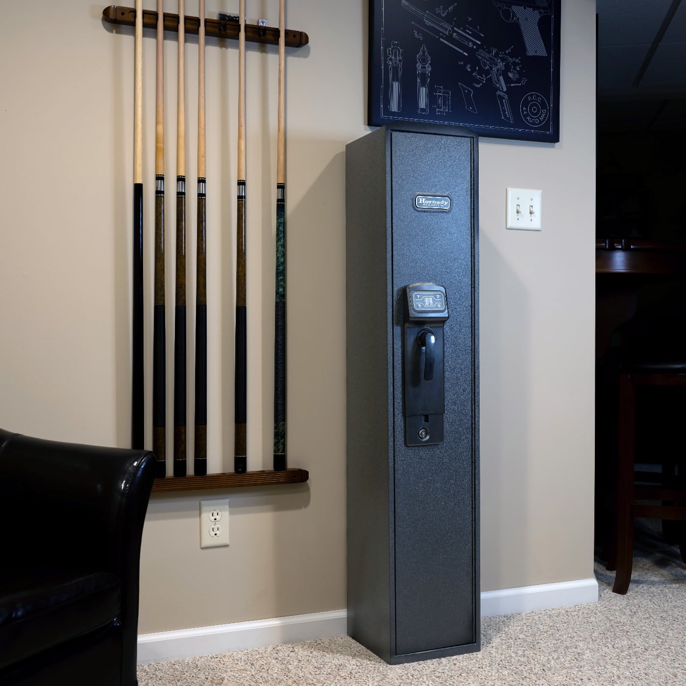 In this photo, we see the Hornady RAPiD Safe Ready Vault in his living room. A gun safe is a safe designed for storing one or more firearms and/or ammunitions.