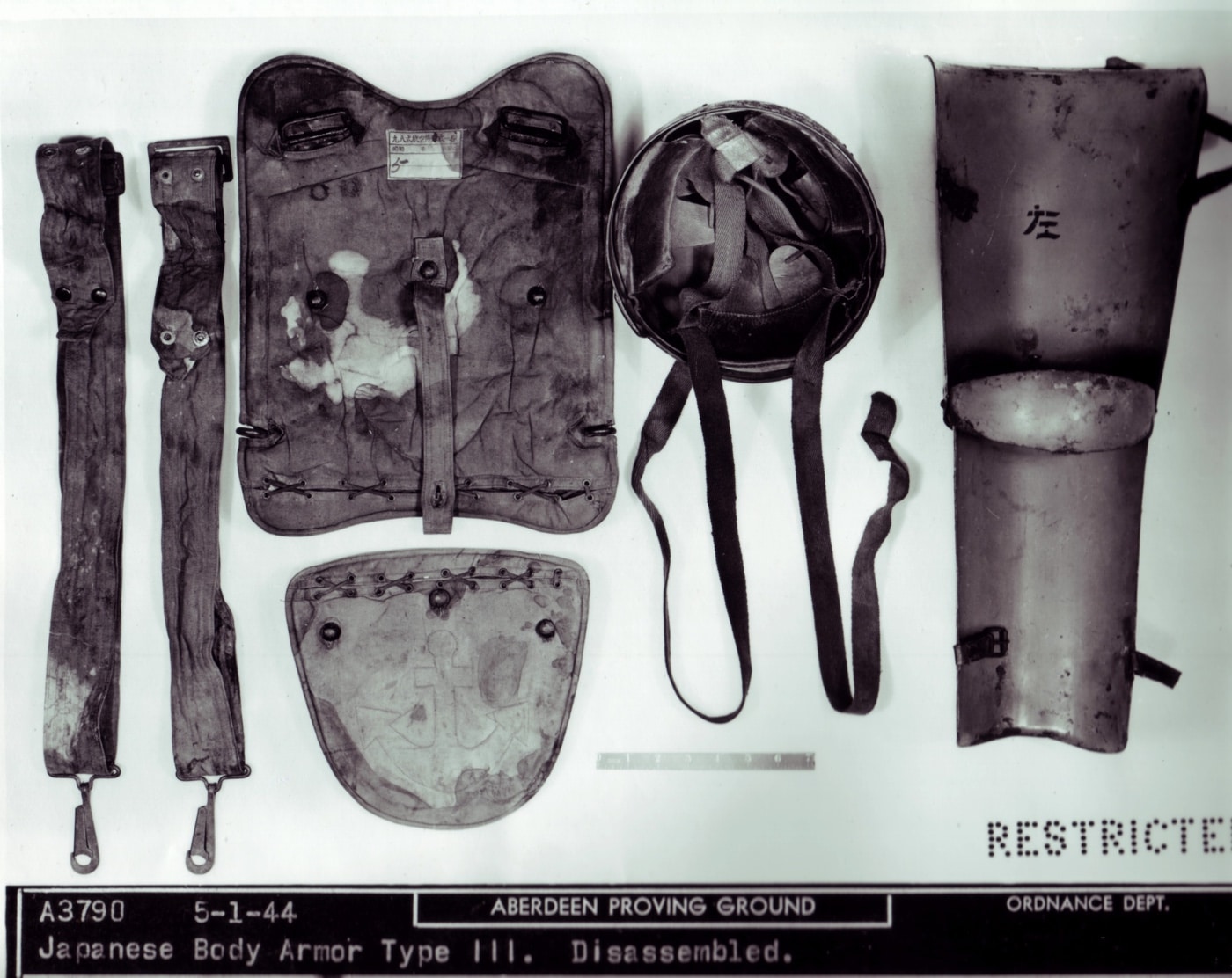 In this photo from the National Archives and Records Administration, we see an Imperial Japanese Army bulletproof vest set known as the Type III. This Japanese armor set included a metal leg shield that severely limited the mobility of the soldier wearing it.