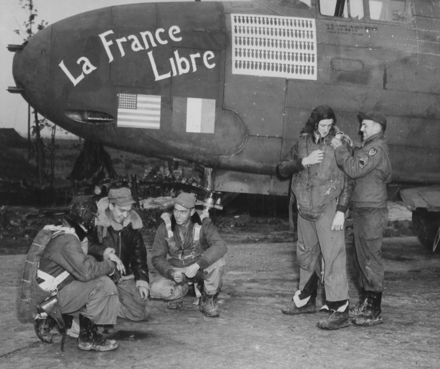 In this digital photograph, the ground crew and aircrew of the La France Libre bomber work together to prepare for a mission. The La France Libre was an A-20 bomber that was the first in the 9th Air Force to complete 100 missions against Nazi Germany. Nazi Germany, officially known as the German Reich until 1943, later the Greater German Reich, is the term used by historians to describe the German state between 1933 and 1945, when Adolf Hitler and the Nazi Party controlled the country, transforming it into a totalitarian dictatorship.