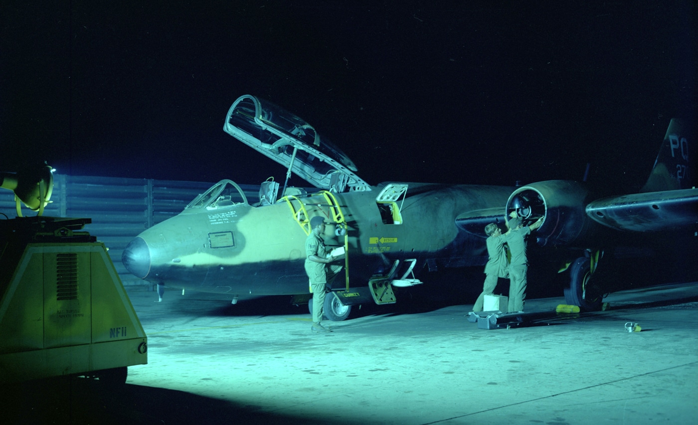 In this photo, three United States Air Force crewmen work on a Martin B-57 Canberra bomber in South Vietnam.