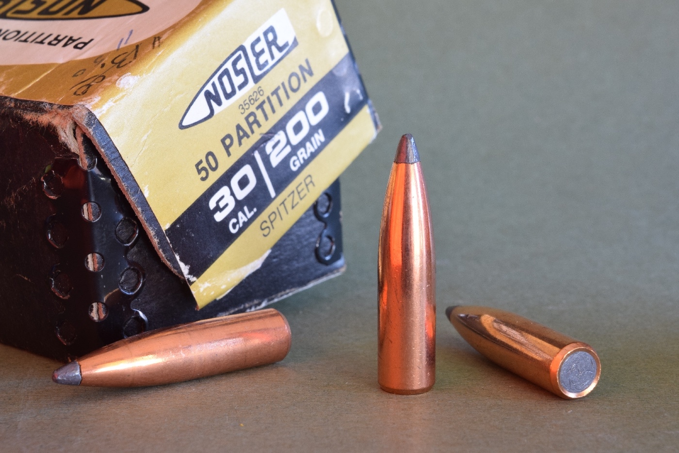 In this photograph, the author shows us three .30-caliber Nosler Partition bullets. They are 200-grains in mass. Nosler produces six different hunting cartridges. The first to be introduced was .26 Nosler, followed by .28 Nosler, .30 Nosler, .33 Nosler, .22 Nosler, and .27 Nosler.