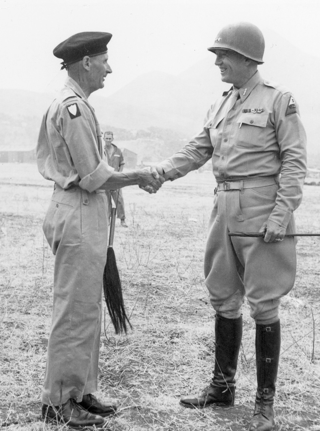 In this photo, Patton shakes hands with Montgomery in Palermo during the Sicily campaign.