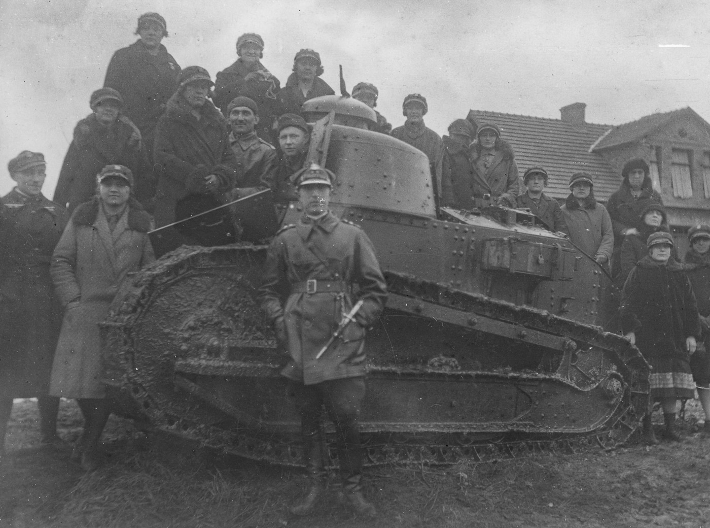 Polish women in a shooting class pose for a photo with the FT-17 tank