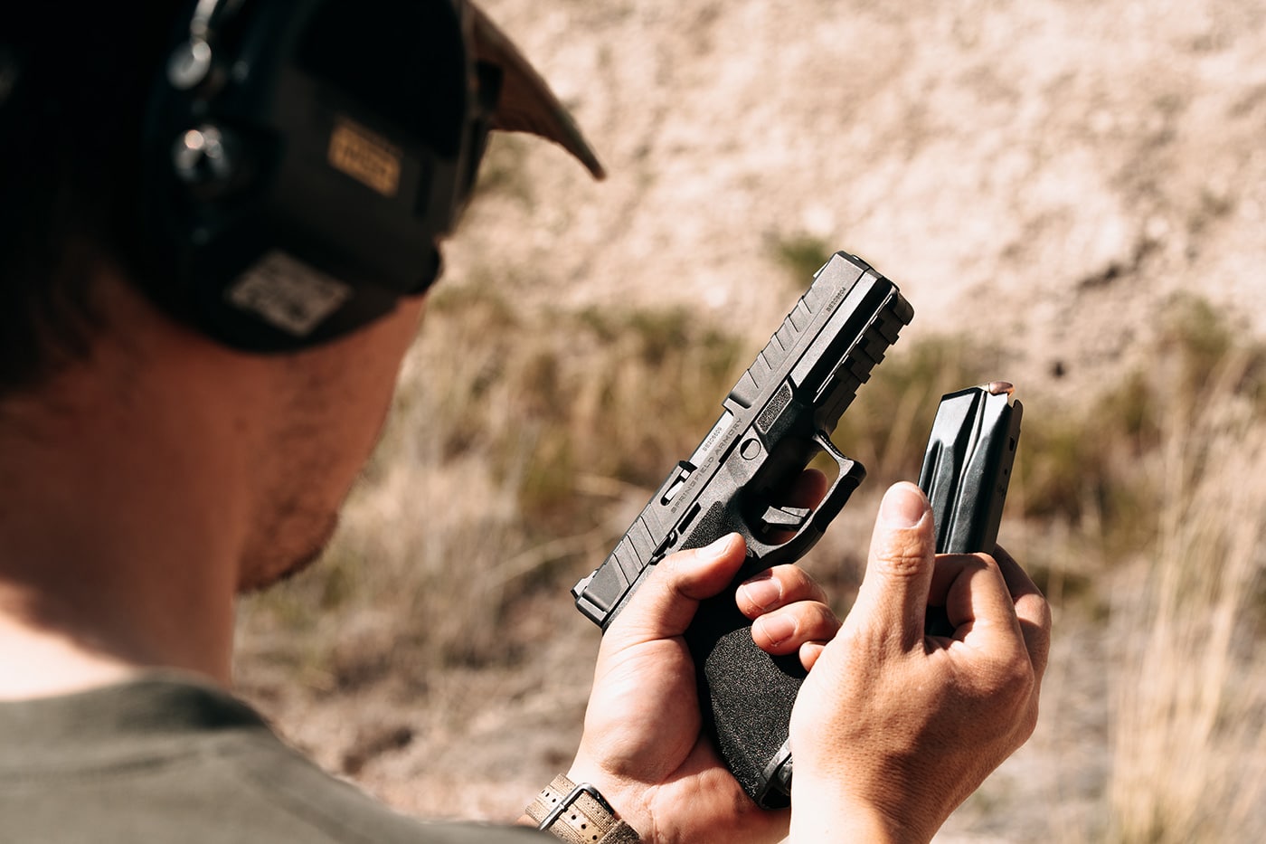 In this photograph, the author demonstrates a speed reload in a Springfield Echelon pistol.