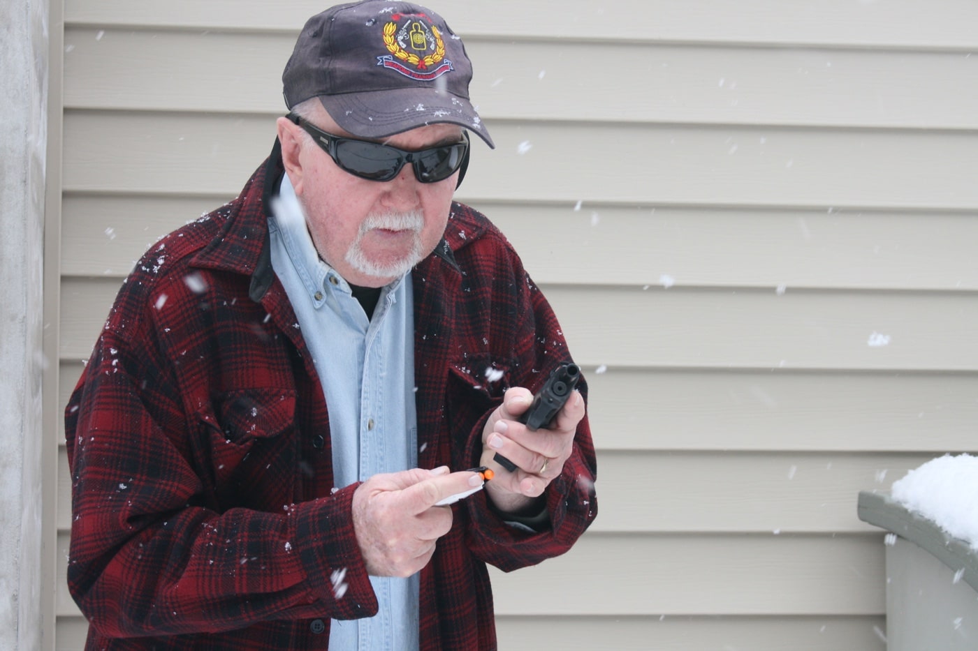 In this photograph, the author practices reloading pistol.