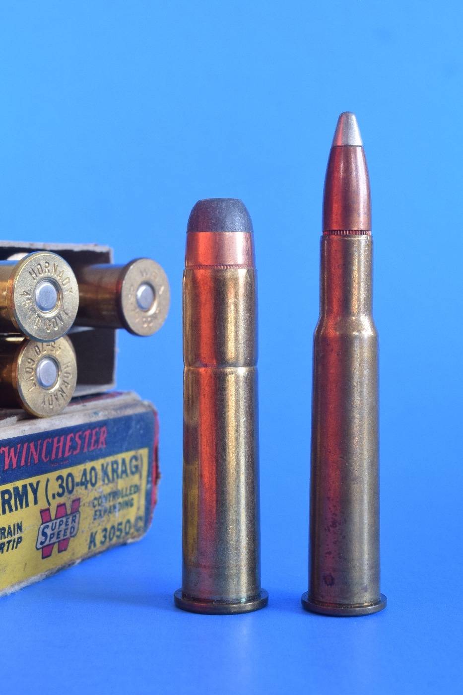 Shown in this photograph is a .30-40 Krag soft point load on the left and a .30-30 Winchester Silvertip load. Silvertip bullets use soft lead and are suitable for self-defense and wild hog hunting due to its stopping power and ballistics. The .30-30 ammo is a rimmed cartridge often used in lever action rifles and handguns. The .30-30 Winchester cartridge was first marketed for the Winchester Model 1894 lever-action rifle in 1895. The .30-30, as it is most commonly known, along with the .25-35 Winchester, was offered that year as the United States' first small-bore sporting rifle cartridges designed for smokeless powder. 