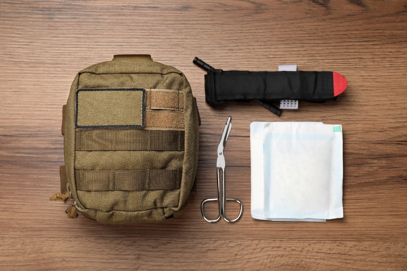 In this photograph, we see the author's TCCC kit for dealing with emergency medical trauma. It includes a tourniquet, sheers and a pressure bandage.