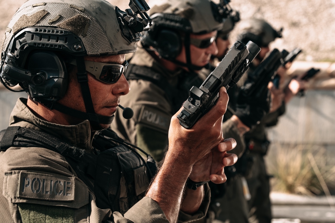 In this photo, police officers are reloading the Echelon pistol during firearms training at the shooting range.